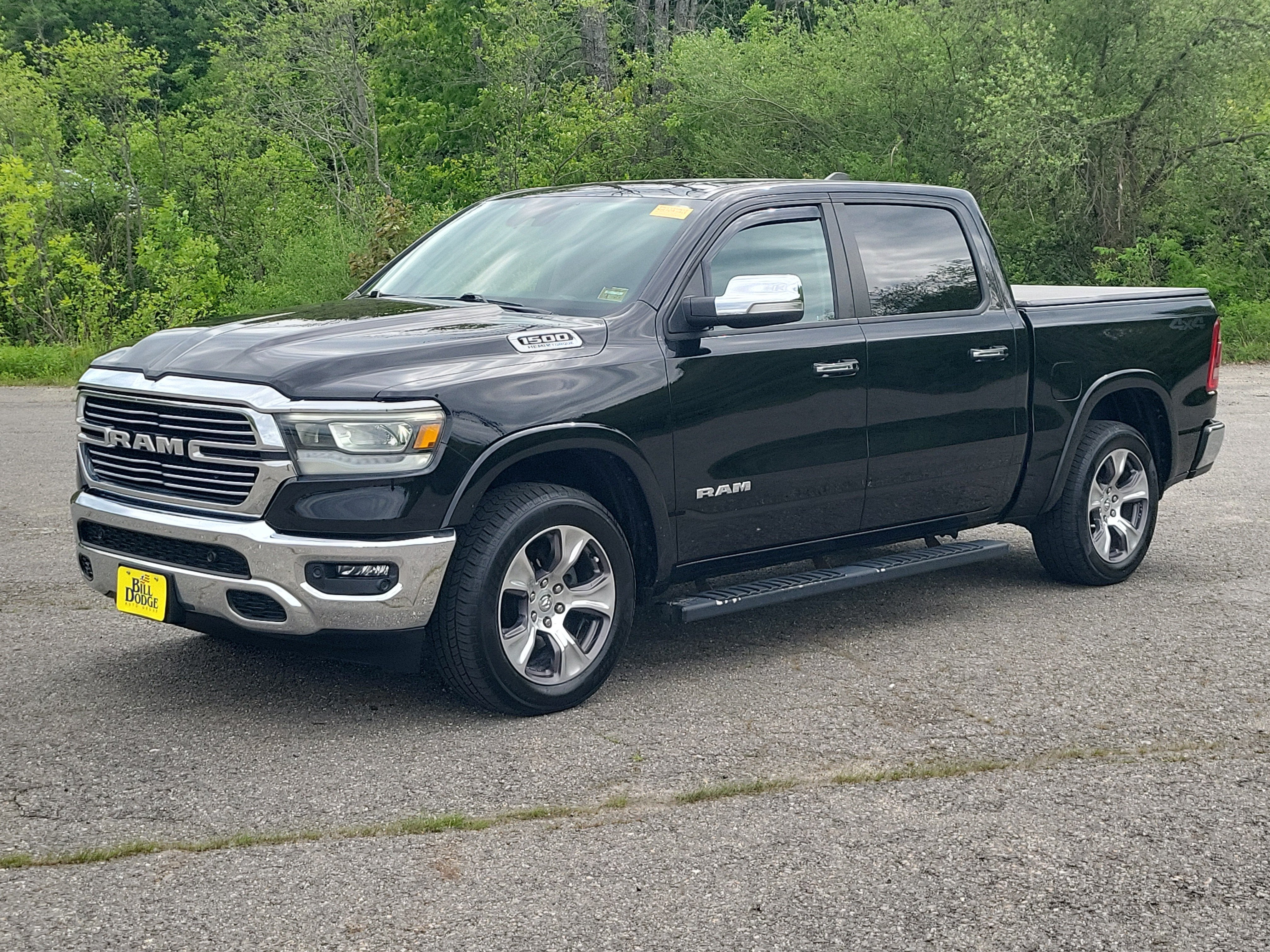 2022 RAM 1500 Laramie Crew Cab 4x4 5'7" Box in Black — front three-quarter view