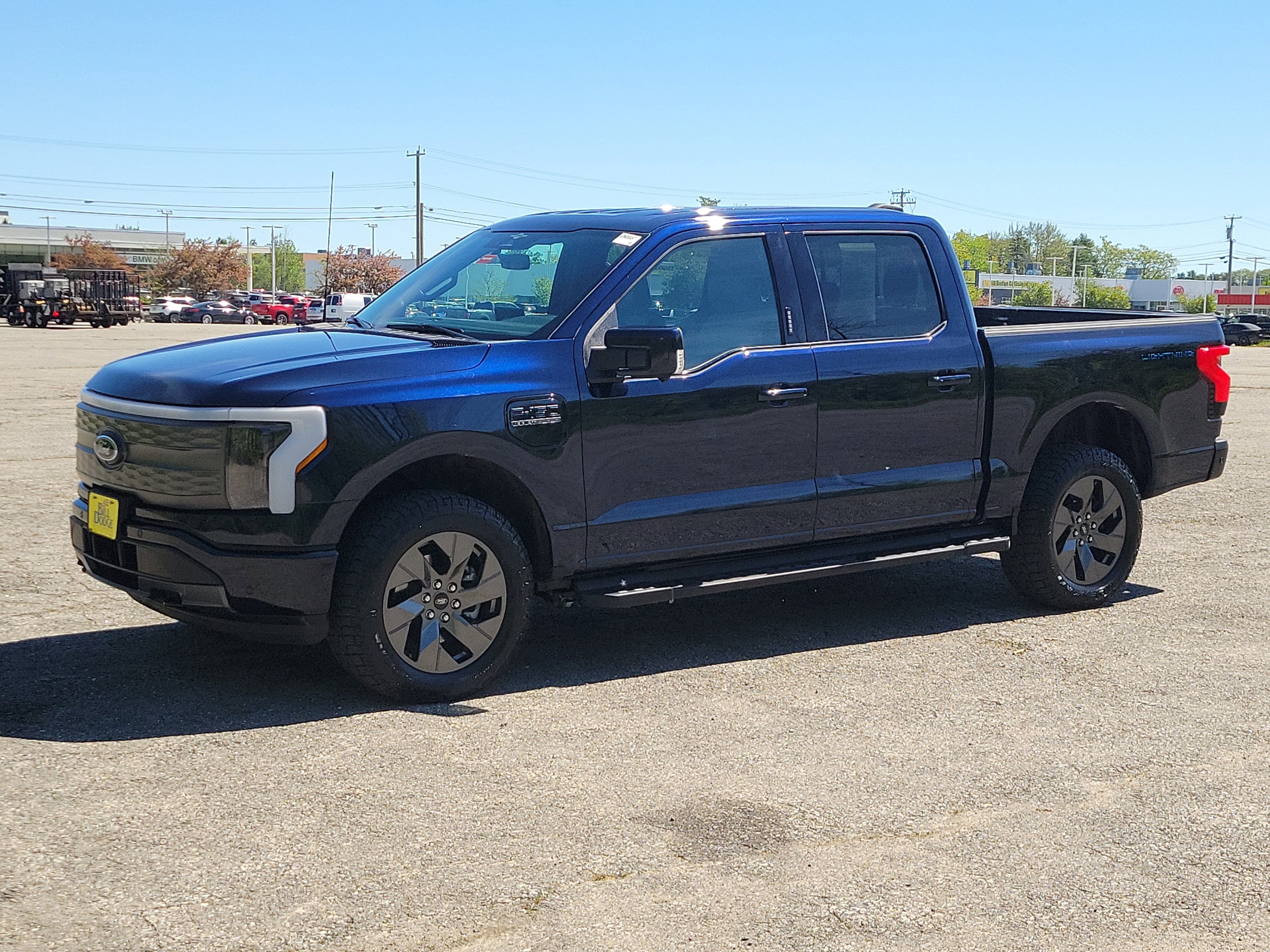 2023 Ford F-150 Lightning LARIAT in Blue — front three-quarter view