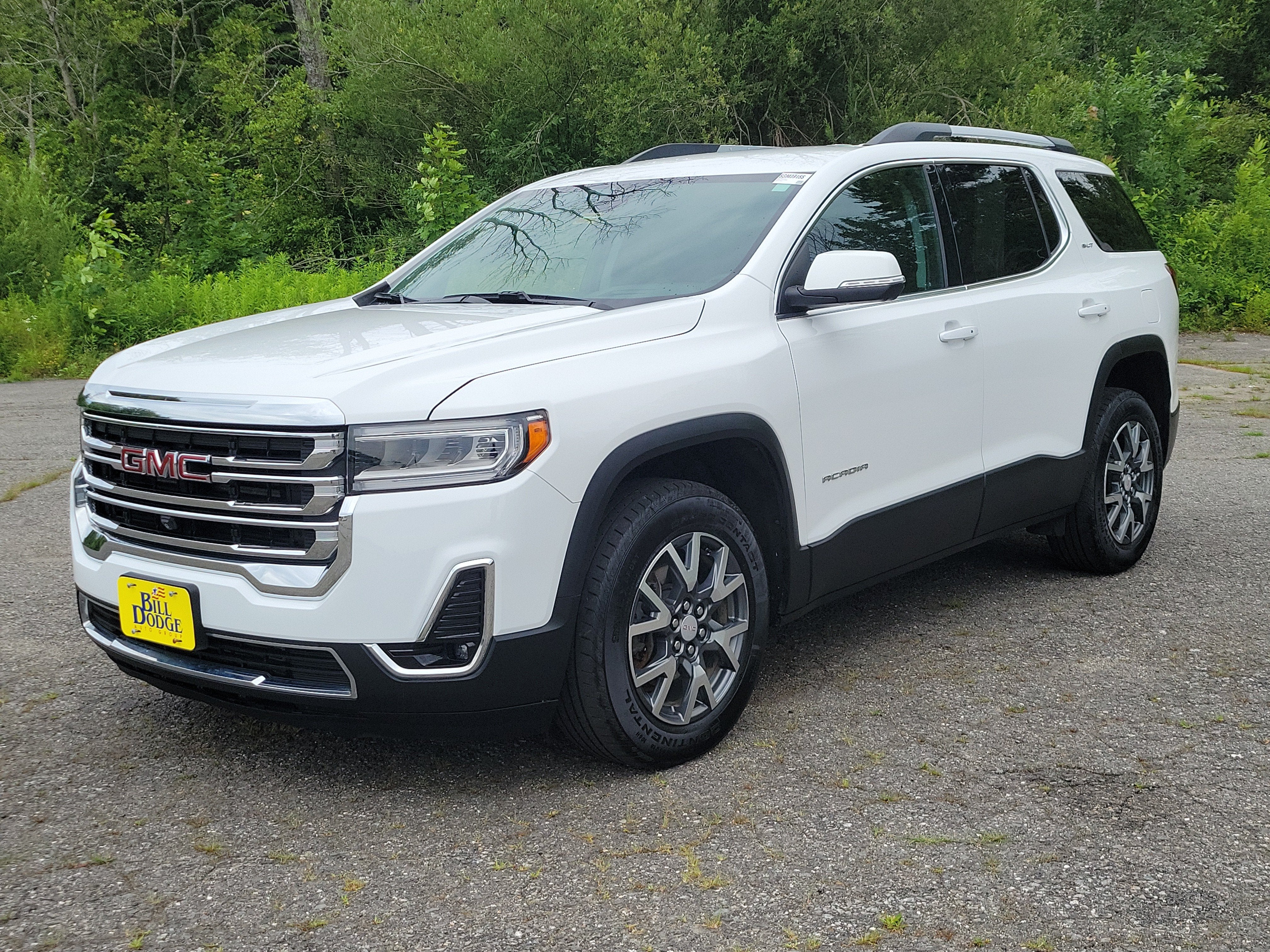 2023 GMC Acadia SLT in Summit White — front three-quarter view