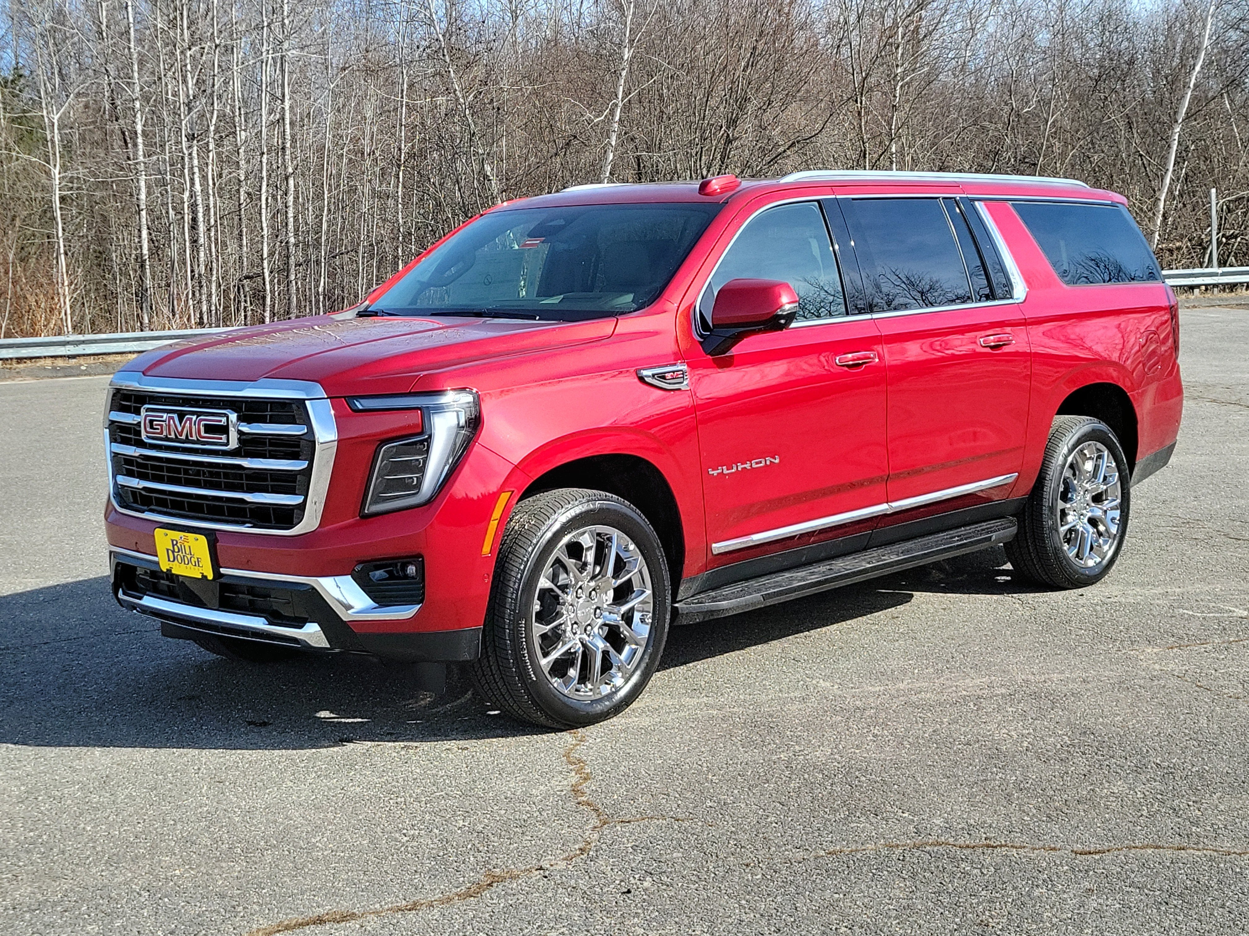 2026 GMC Yukon XL Elevation in Volcanic Red Tintcoat — front three-quarter view