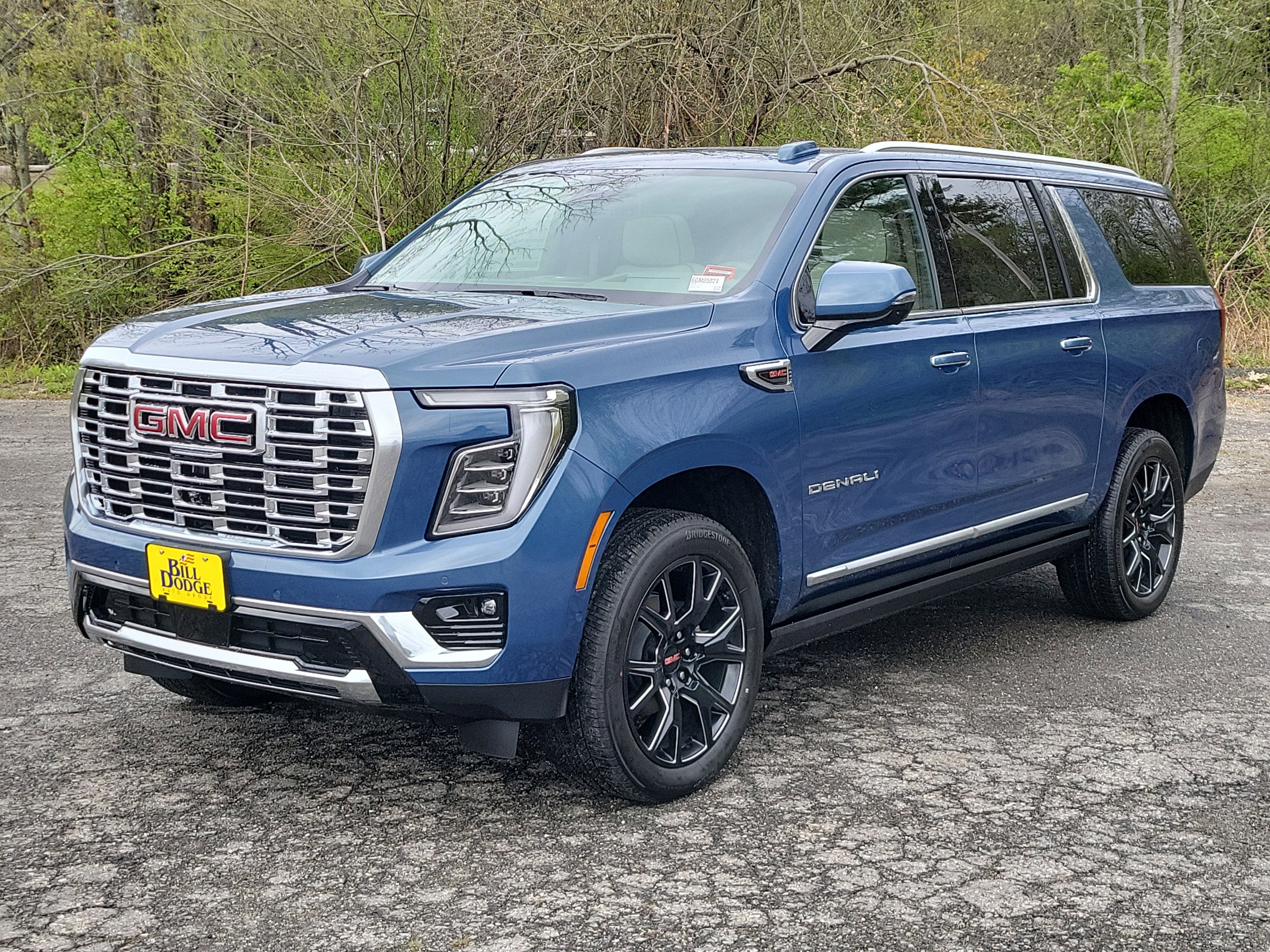 2026 GMC Yukon XL Denali in Downpour Metallic — front three-quarter view