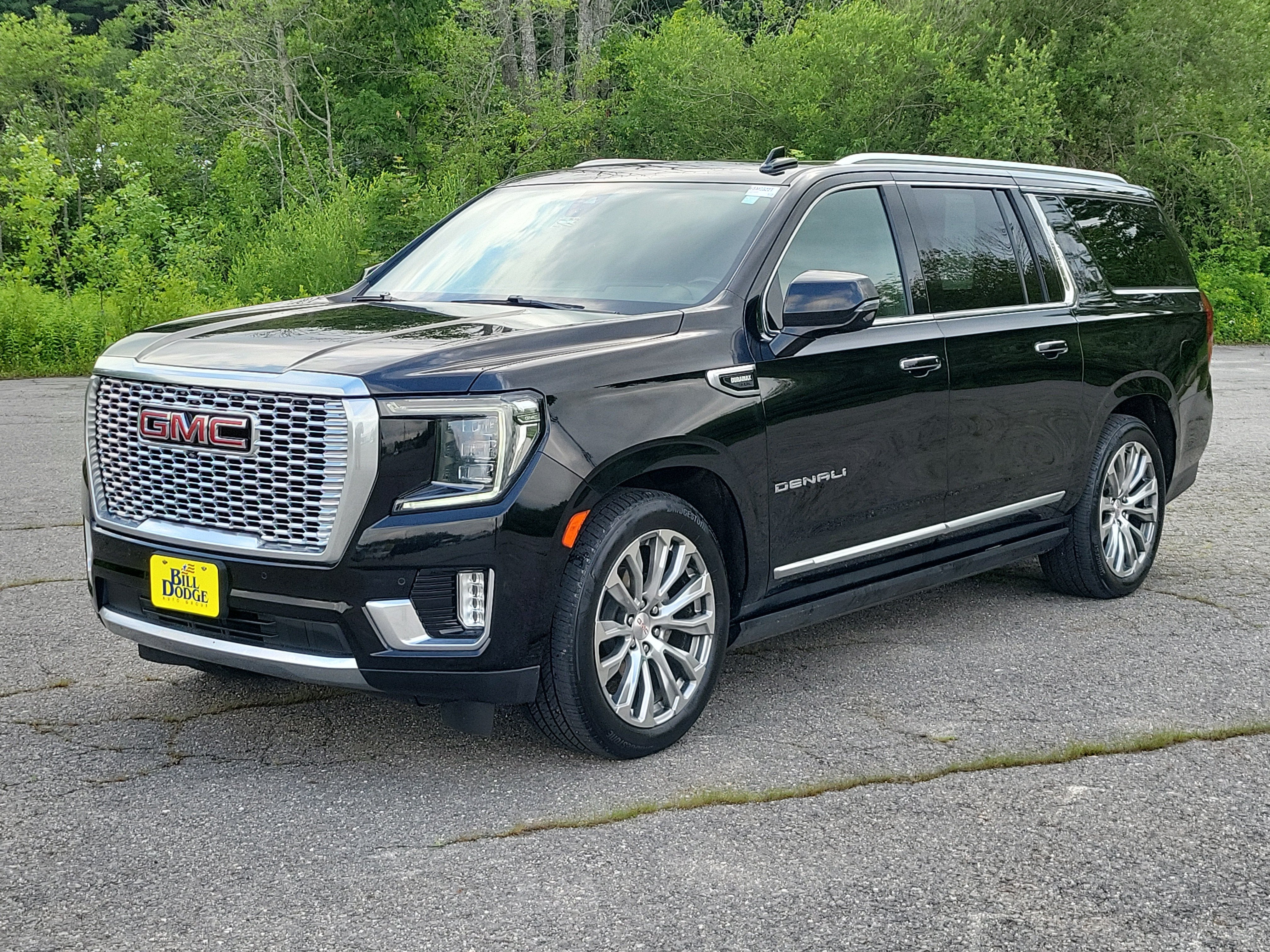 2021 GMC Yukon XL Denali in Onyx Black — front three-quarter view