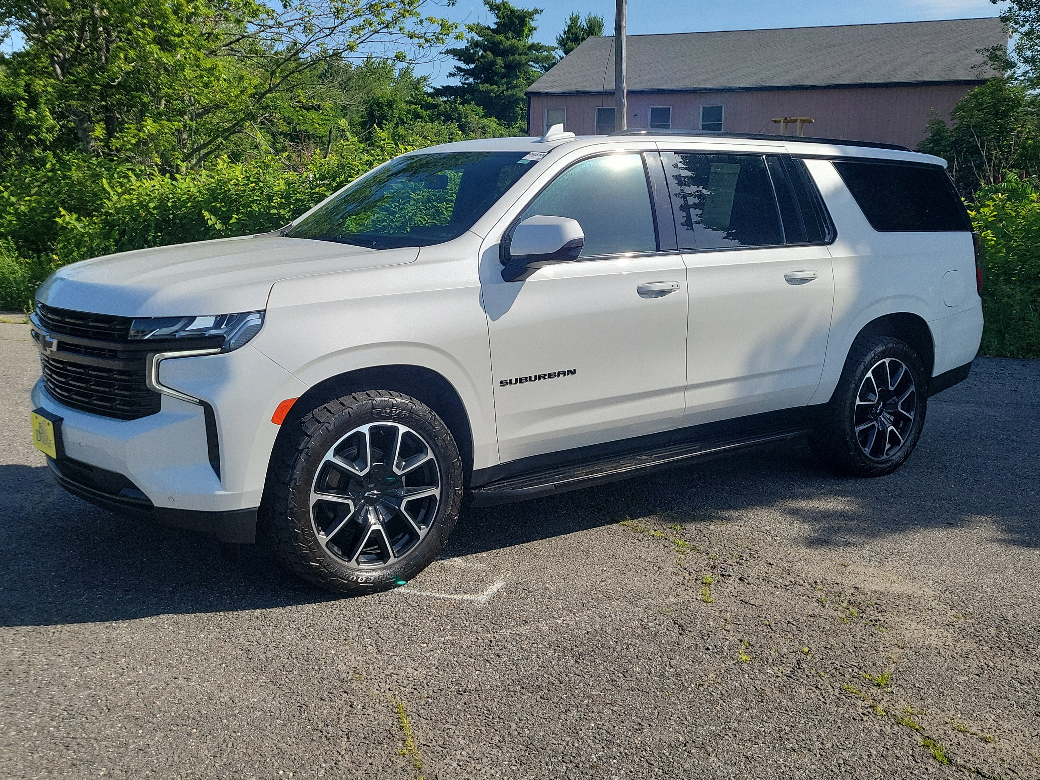 2023 Chevrolet Suburban RST in Iridescent Pearl Tricoat — front three-quarter view
