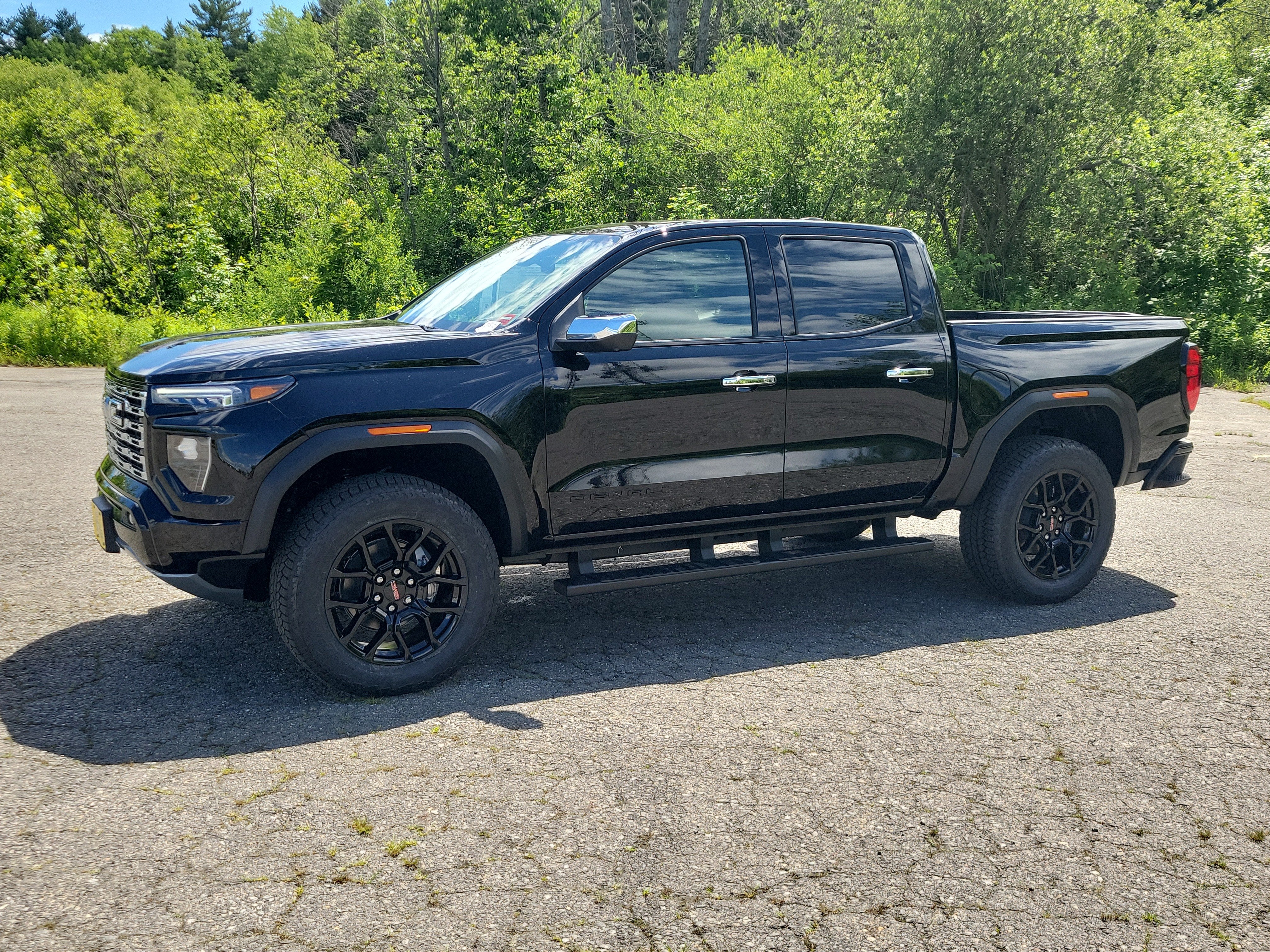 2026 GMC Canyon Denali in Onyx Black — front three-quarter view