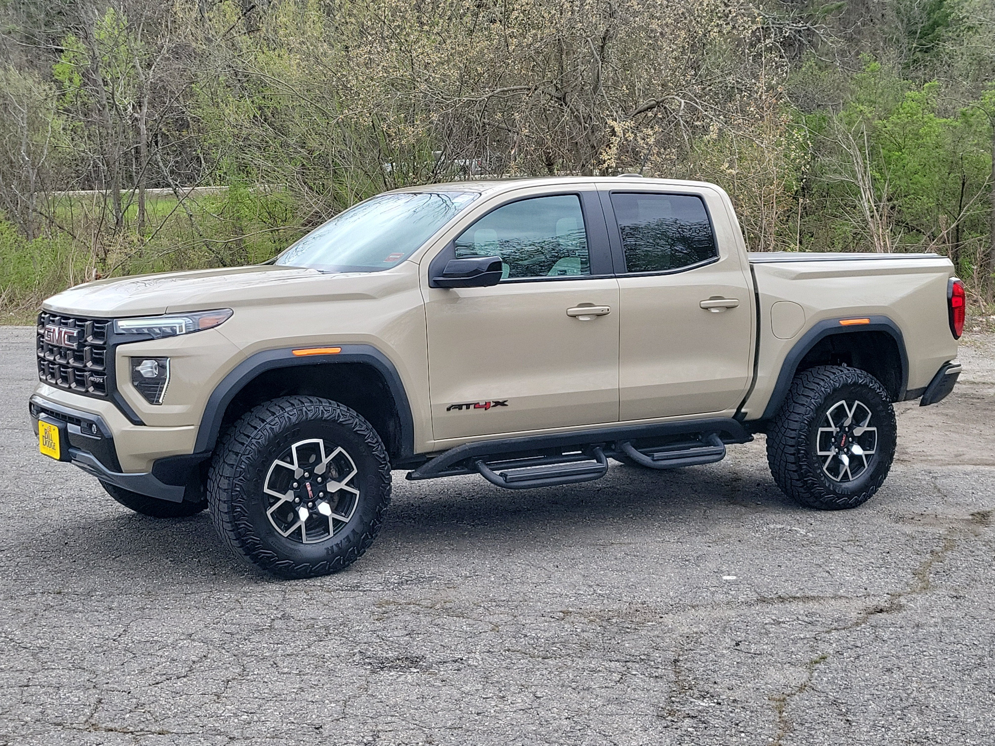 2024 GMC Canyon AT4X in Desert Sand Metallic — front three-quarter view