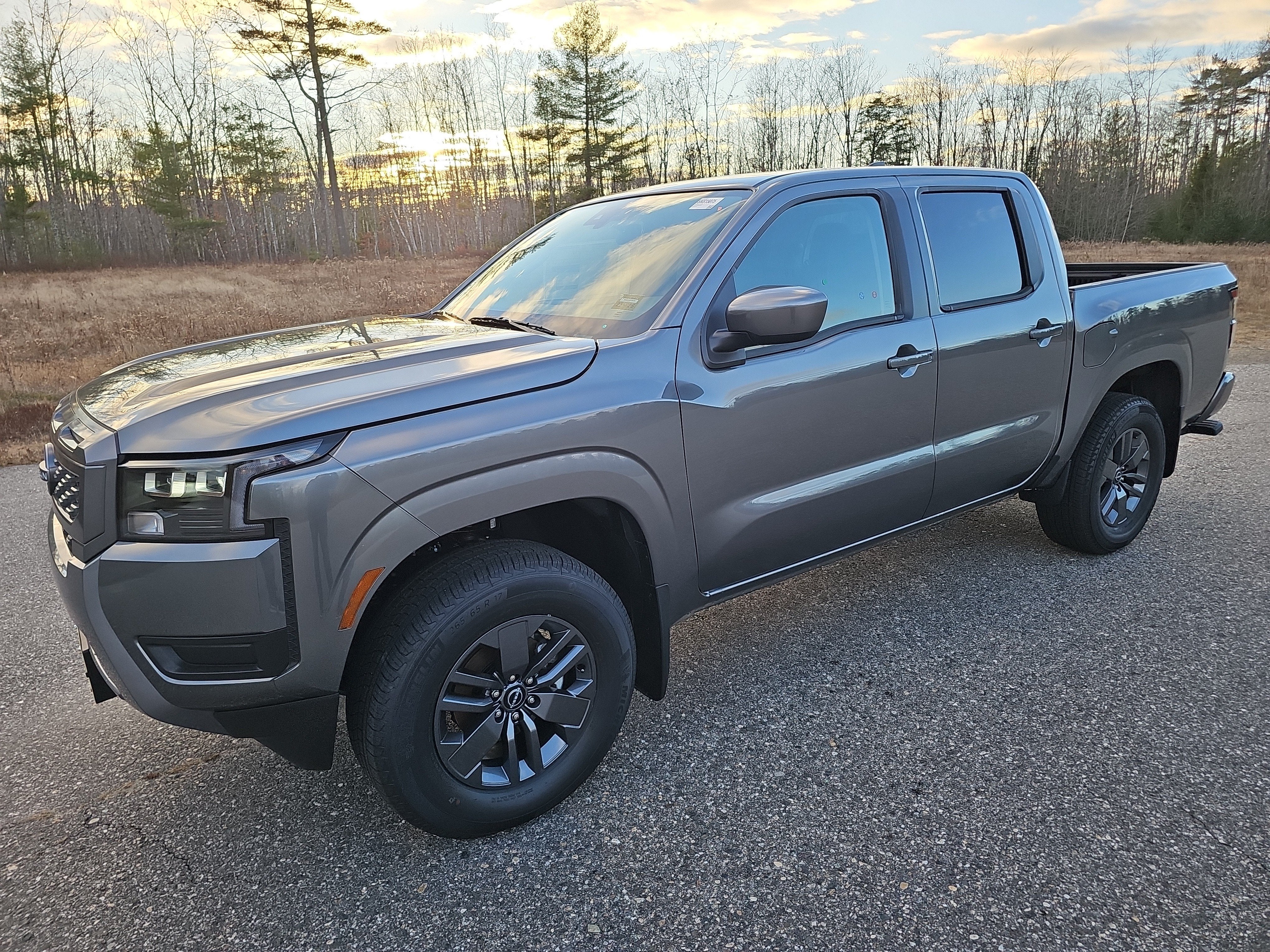 2026 Nissan Frontier Crew Cab SV 4x4 in Gray — front three-quarter view