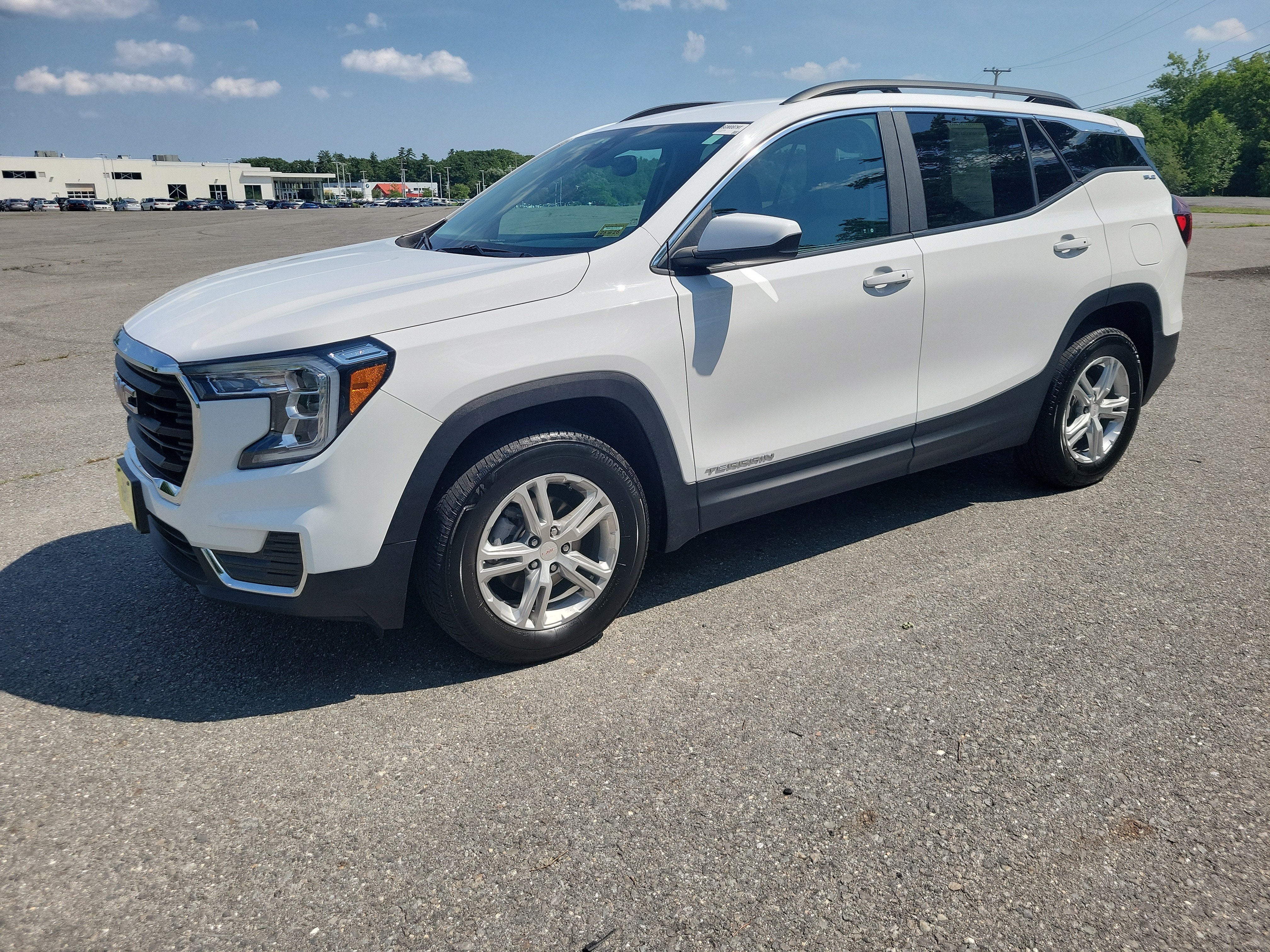 2023 GMC Terrain SLE in Summit White — front three-quarter view