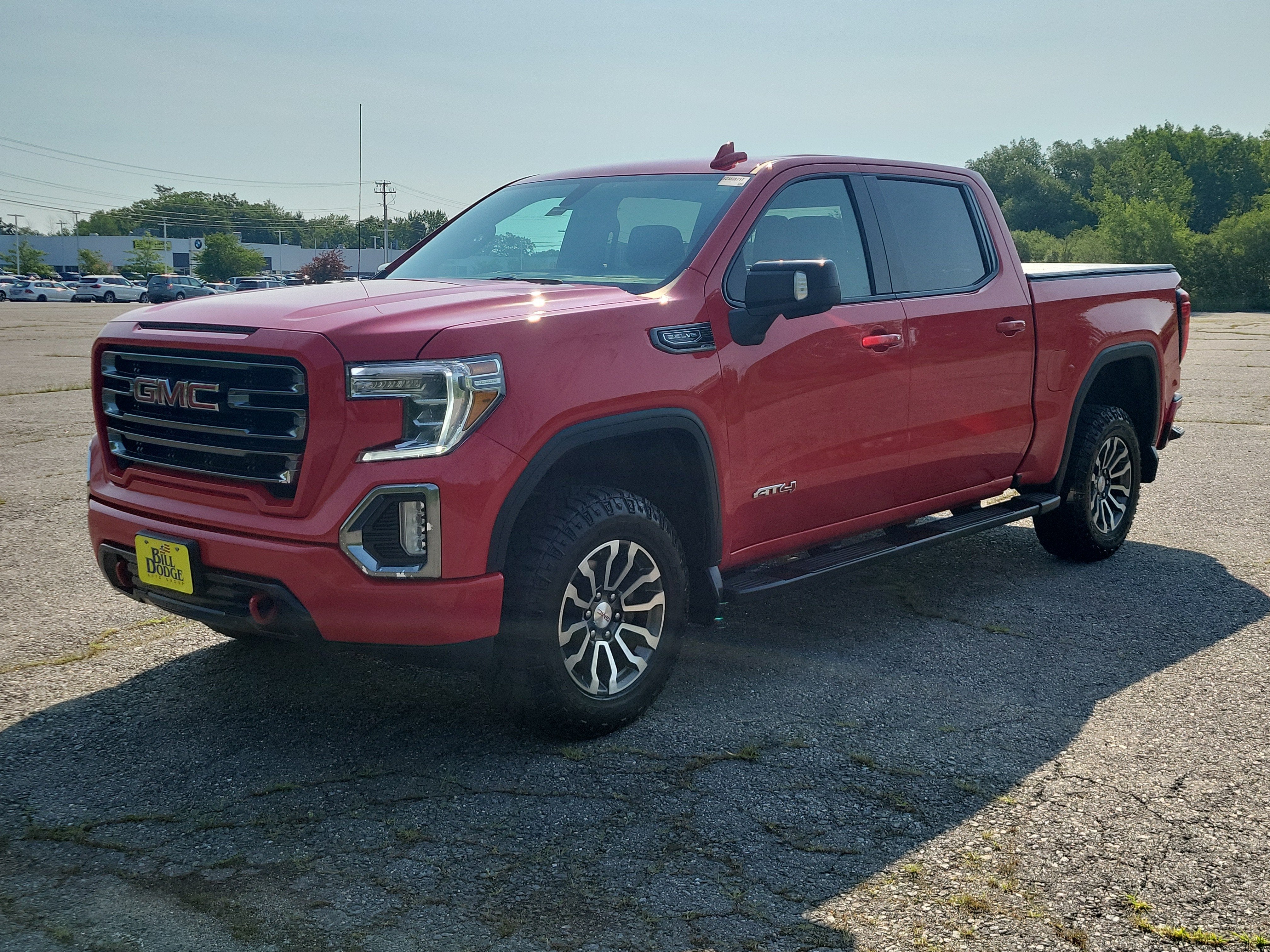 2021 GMC Sierra 1500 AT4 in Cardinal Red — front three-quarter view
