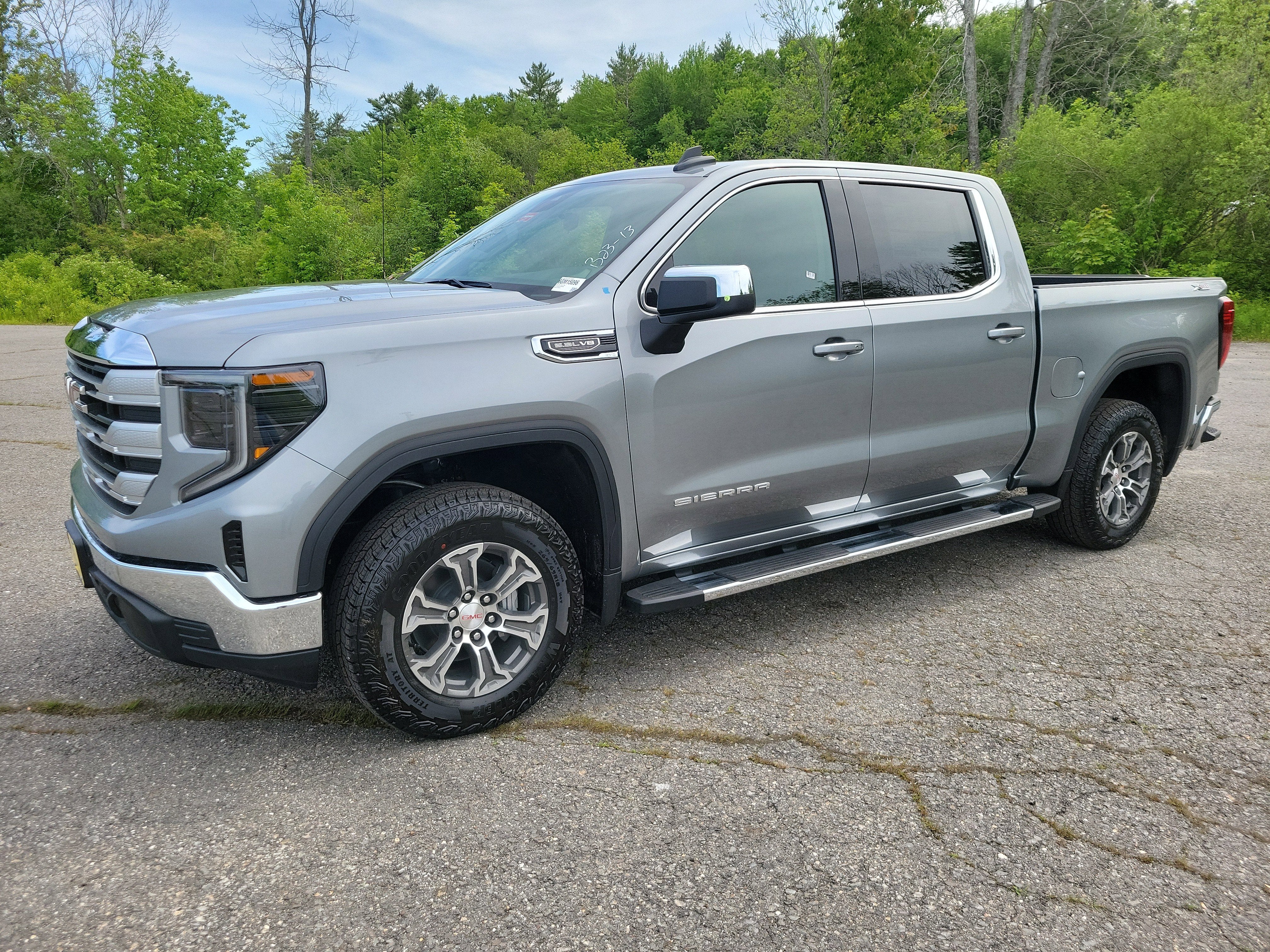 2026 GMC Sierra 1500 SLE in Sterling Metallic — front three-quarter view
