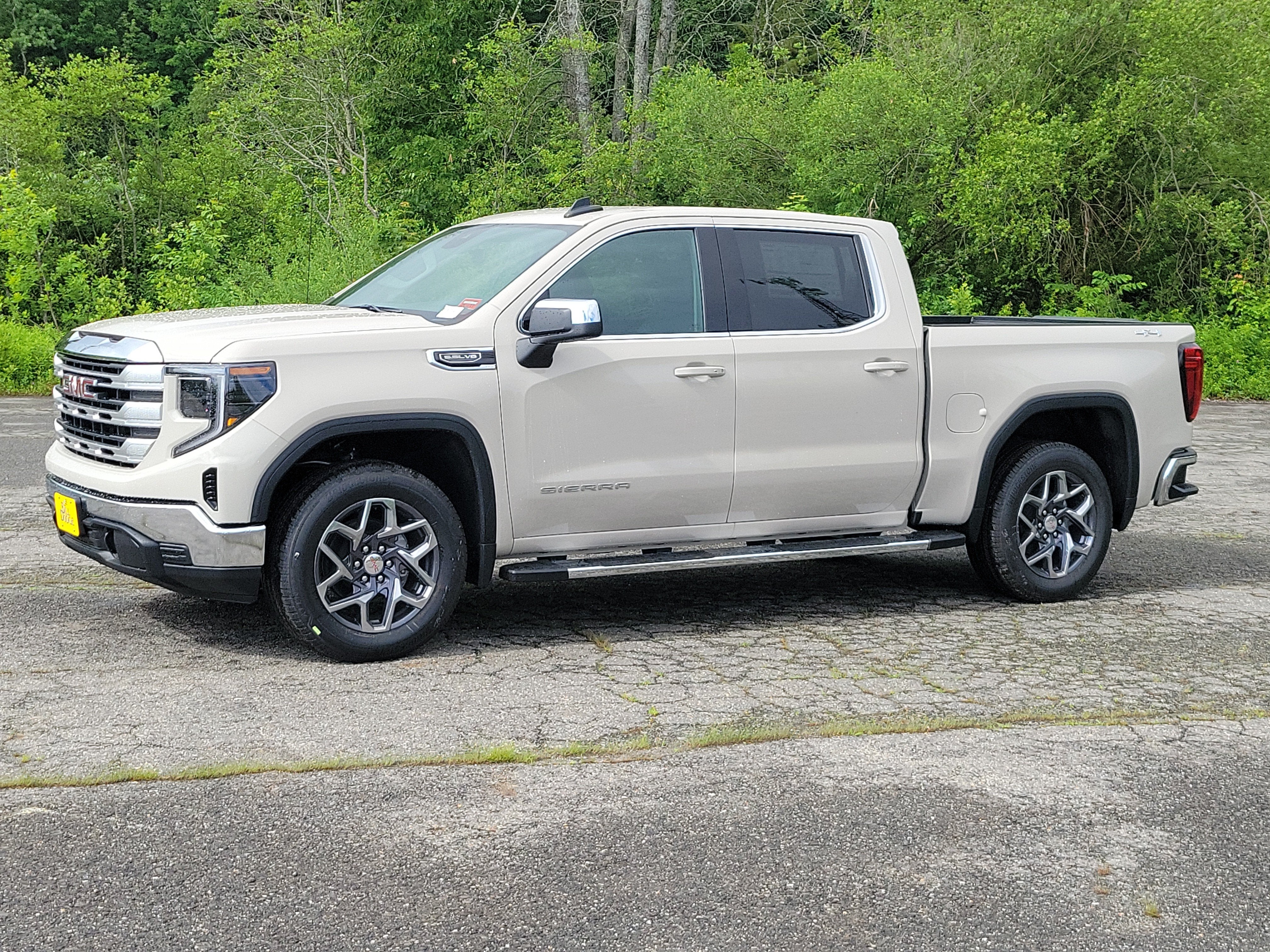 2026 GMC Sierra 1500 SLE in Coastal Dune — front three-quarter view