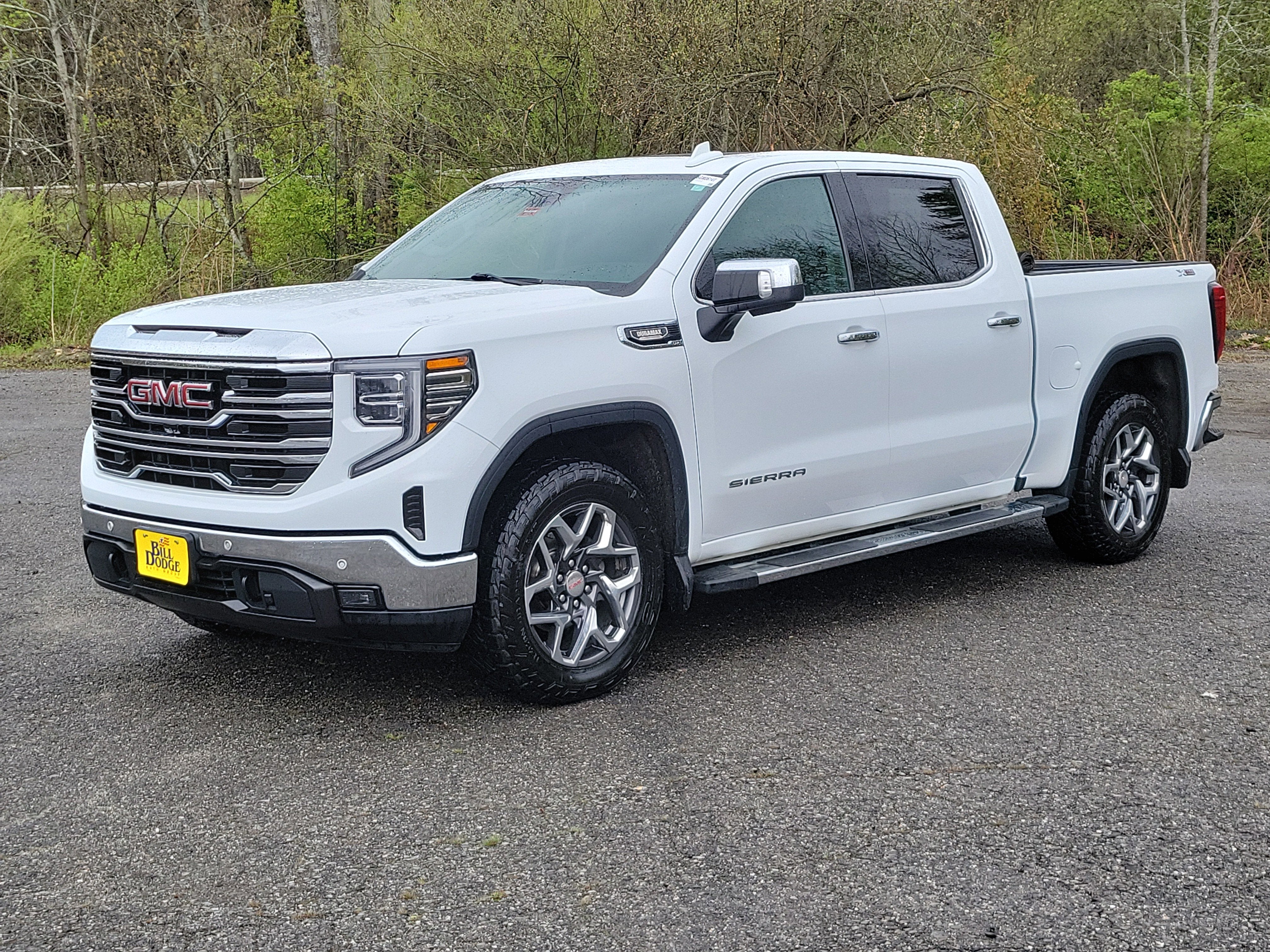 2023 GMC Sierra 1500 SLT in Summit White — front three-quarter view
