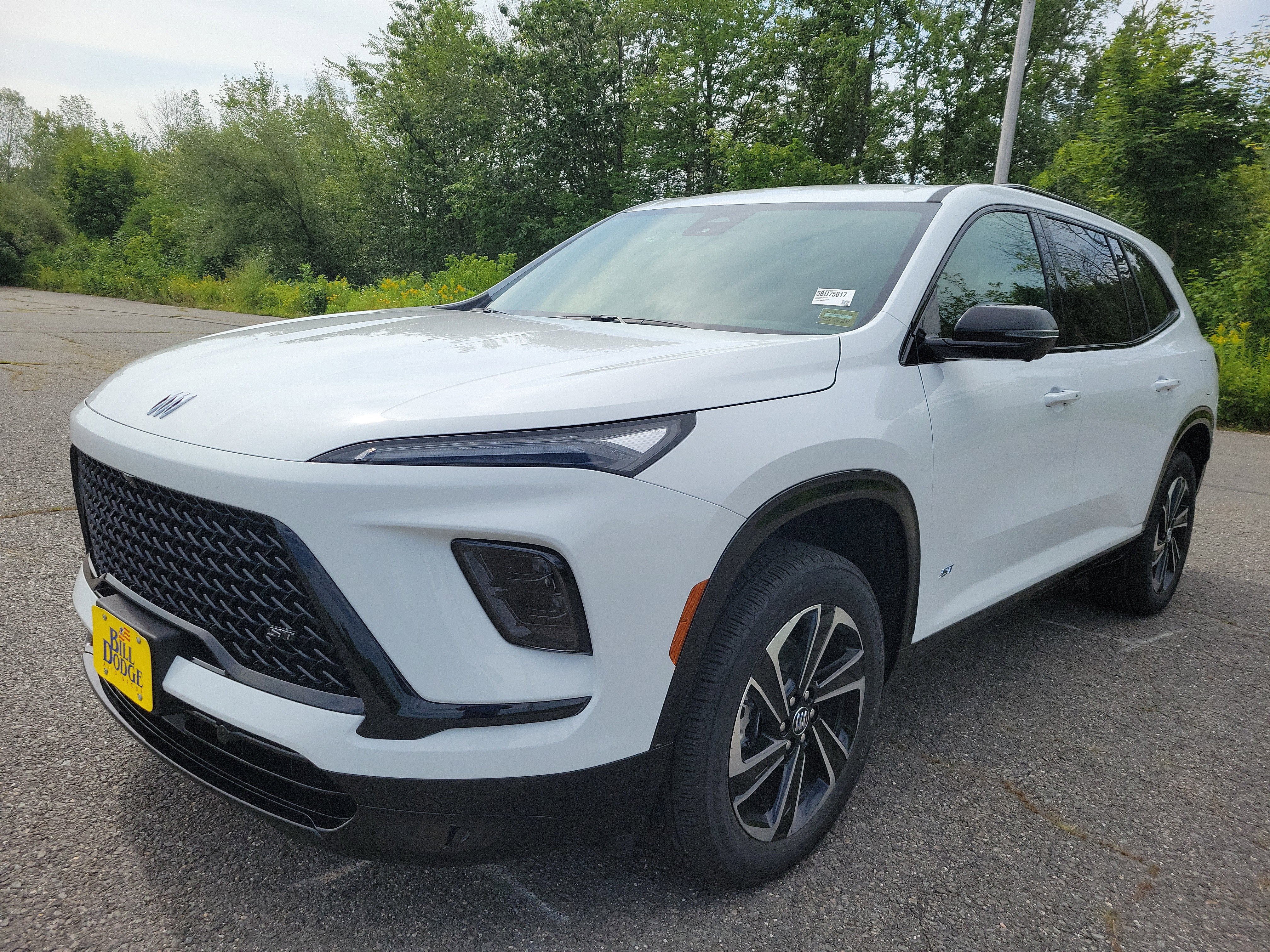 2026 Buick Enclave Sport Touring in Summit White — front three-quarter view