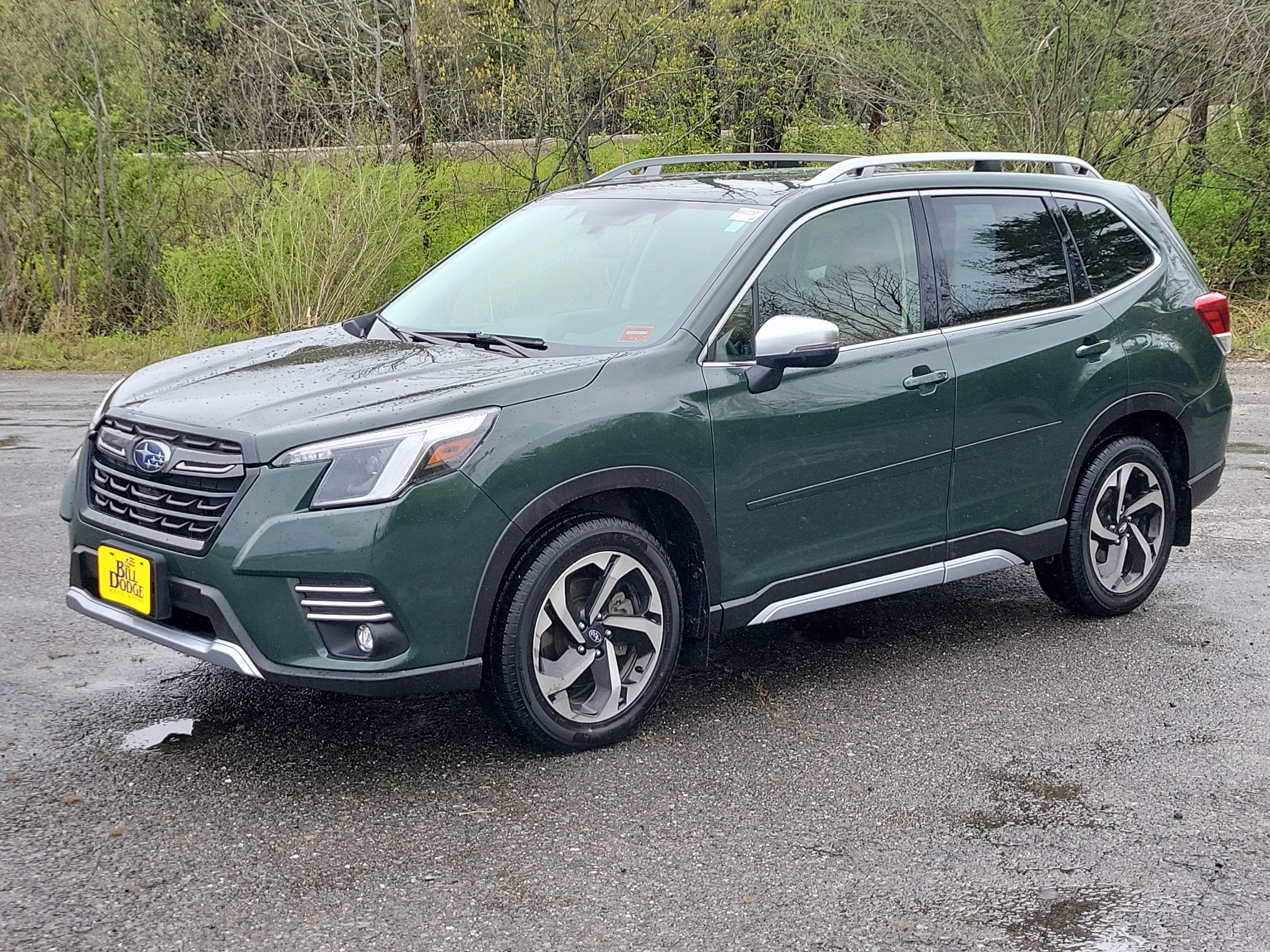 2023 Subaru Forester Touring in Green — front three-quarter view